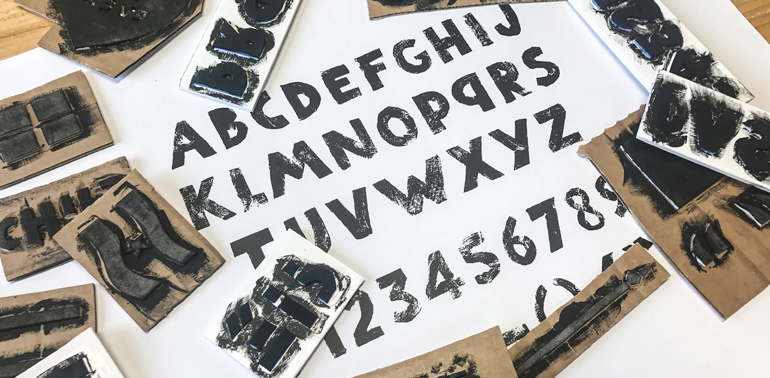 CHIPS bespoke charity brand typeface, showing development using a handmade linocut method