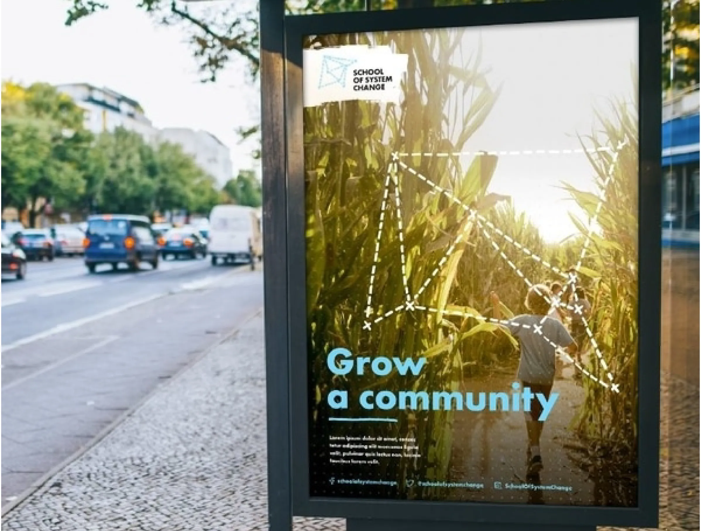 School of System Change brand by IE Brand applied to posters, showing someone walking through a field of tall wheat