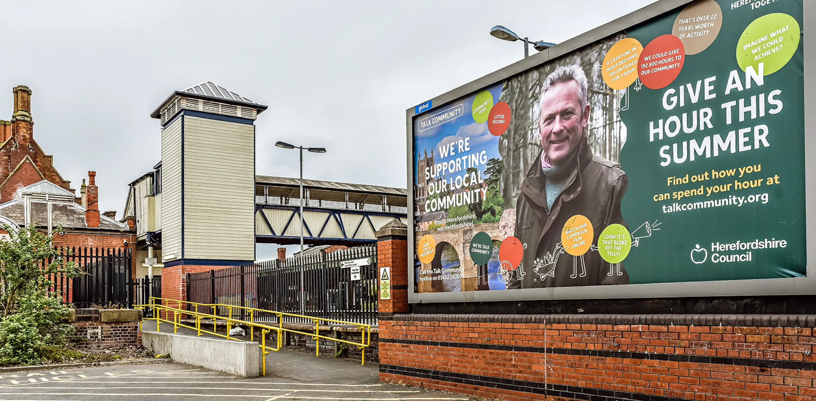 Photo of a Talk Community billboard outside Hereford railway station